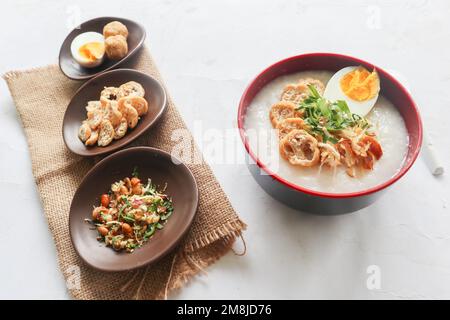 congee porridge with chicken slice, tofu, egg. congee porridge from hong kong. chinese food Stock Photo