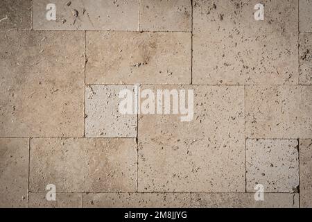 Close up overhead view a travertine brick in beige colors. Stock Photo