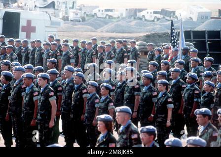 Soldiers, Sailors, Marines and Airmen of Joint Task Force Provide Promise stand in formation while the colors are being presented. They are being awarded the United Nations Medal for Service for the period of March 1994 through July 1994. The United States contingent provided critical humanitarian and medical aid to the people of the former Republic of Yugoslavia. Subject Operation/Series: PROVIDE PROMISE Base: US Contingents Hq, Camp Pleso State: Zagreb Country: Croatia (HRV) Stock Photo