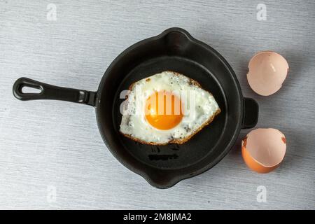 fried egg in a frying pan Stock Photo