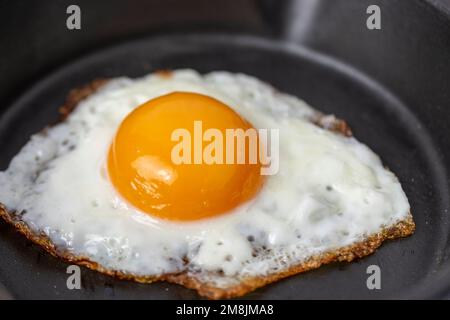 fried egg in a frying pan Stock Photo