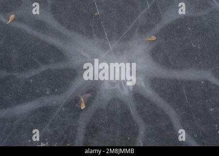 cracked ice texture, abstract seasonal winter cold background, natural ice, broken ice on a lake Stock Photo