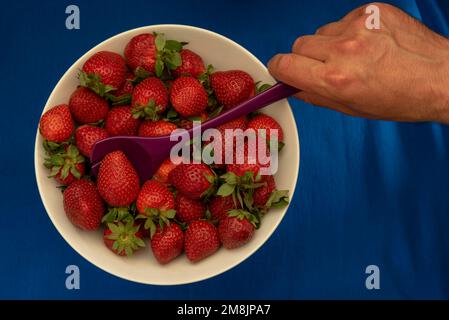 strawberries being prepared for a cocktail Stock Photo