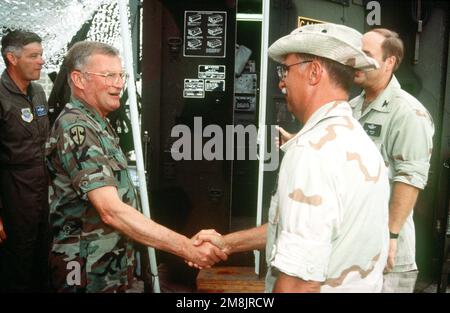 GEN. John M. Shalikashvili, chairman of the Joint Chiefs of STAFF, meets and greets the troops working at Moi International Airport. Subject Operation/Series: SUPPORT HOPE Base: Mombasa Country: Kenya (KEN) Stock Photo