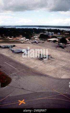 Aerial shot of C-141 Starlifters and a C-130 Hercules parked on the ramp at the airport. Mombasa is one of the main staging areas for airlift missions flying into Goma, Zaire to deliver relief goods to the Rwandan refugees. Subject Operation/Series: SUPPORT HOPE Base: Mombasa International Airport Country: Kenya (KEN) Stock Photo