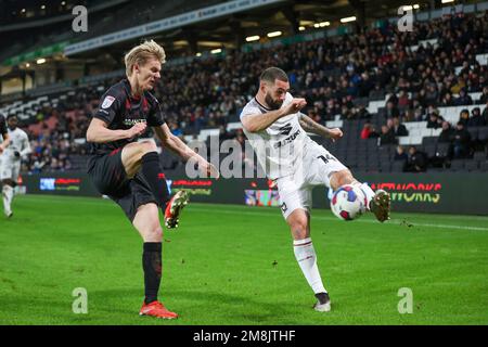 Milton Keynes Dons Bradley Johnson is challenged by Lincoln City's Lasse Sørensen during the second half of the Sky Bet League 1 match between MK Dons and Lincoln City at Stadium MK, Milton Keynes on Saturday 14th January 2023. (Credit: John Cripps | MI News) Credit: MI News & Sport /Alamy Live News Stock Photo