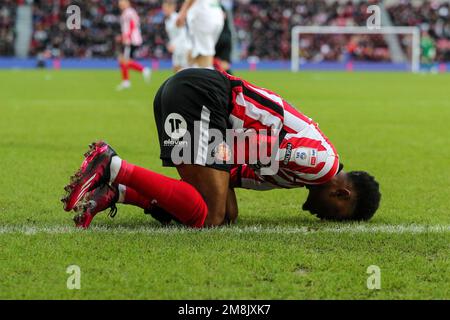 Sunderland, UK. 14th Jan, 2023. Amad Diallo #16 of Sunderland down injured after a battle with Liam Cullen #20 of Swansea City during the Sky Bet Championship match Sunderland vs Swansea City at Stadium Of Light, Sunderland, United Kingdom, 14th January 2023 (Photo by Dan Cooke/News Images) in Sunderland, United Kingdom on 1/14/2023. (Photo by Dan Cooke/News Images/Sipa USA) Credit: Sipa USA/Alamy Live News Stock Photo