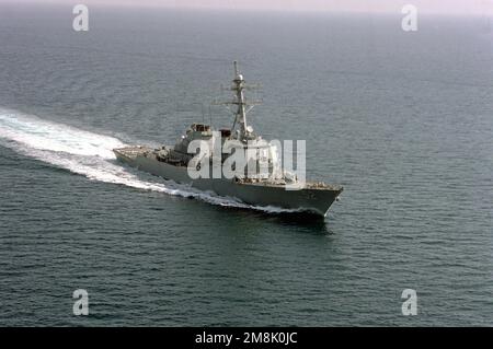 An aerial starboard bow view of the guided missile destroyer USS BARRY (DDG-52) underway at speed. Country: Unknown Stock Photo