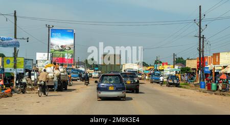 Driving on paved roads / highways in Uganda, Eastern Africa, photographed from inside a moving vehicle. Stock Photo