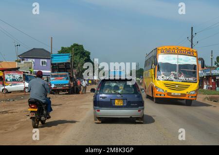 Driving on paved roads / highways in Uganda, Eastern Africa, photographed from inside a moving vehicle. Stock Photo