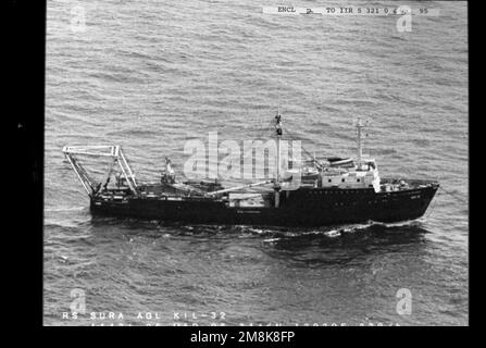 Aerial starboard side view of the former Russian Navy Sura Class mooring buoy tender KIL-32 under tow enroute to a foreign scrapping facility. Country: East China Sea Stock Photo