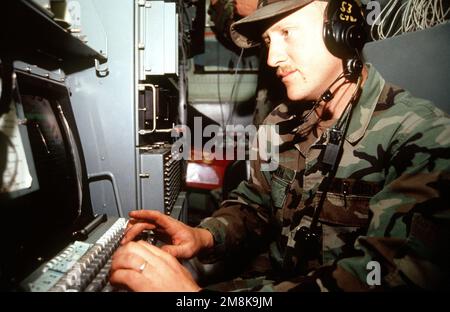 SENIOR AIRMAN Brian E. Smith, a technical controller from the 53rd Combat Communication Squadron, Robins Air Force Base, Ga., ensures communication equipment is on-line at Roswell Industrial Air Center during the annual air defense exercise. Subject Operation/Series: ROVING SANDS '95 Base: Roswell State: New Mexico (NM) Country: United States Of America (USA) Stock Photo