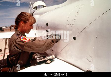 US Air Force CAPT. Karen Brown, a T-38 Talon Instructor Pilot with the 87th Flying Training Squadron, Laughlin Air Force Base, Del Rio, Texas, performs a preflight check of the aircraft prior to take off for another mission during the annual air defense exercise. Subject Operation/Series: ROVING SANDS '95 Base: Roswell State: New Mexico (NM) Country: United States Of America (USA) Stock Photo