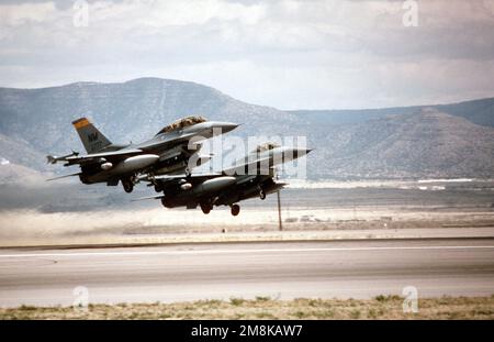 A medium right side view of two US Air Force F-16 Fighting Falcons from the 188th Fighter Squadron, Kirtland Air Force Base, NM, take off from Albuquerque Airport during the annual air defense exercise. Subject Operation/Series: ROVING SANDS '95 Base: Albuquerque State: New Mexico (NM) Country: United States Of America (USA) Stock Photo