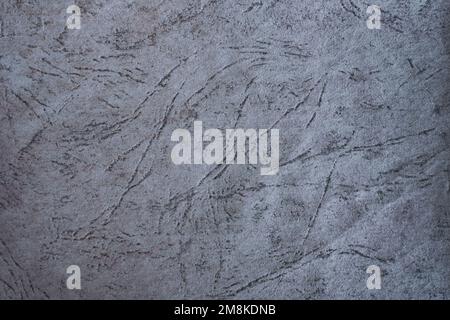 Background of crumpled gray cardboard with an abstract pattern in the form of thin stripes. Backdrop Stock Photo