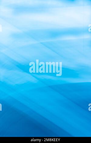 Blue vertical abstract background banner with wave lines crossing and soft gradient. Backdrop Stock Photo