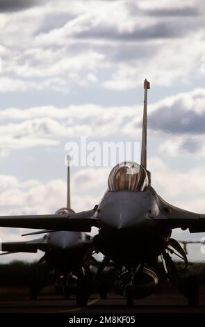 A close-up front view of a pair of F-16 Fighting Falcons from the 13th Fighter Squadron, Misawa Air Base, Japan. The aircraft prepares for take off to defend the base from a strike package consisting of Royal Australian Air Force F-18s from Squadrons 3 and 77. Subject Operation/Series: IRON FIST '95 Base: Raaf Williamstown Country: Australia (AUS) Stock Photo