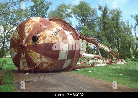 A view of the old water tower after it was brought down by explosives by members of Underwater Construction Team Two (UCT-2). State: Midway Island Stock Photo