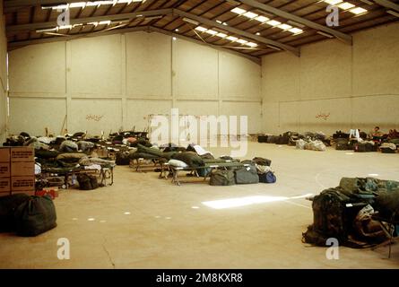 Inside shot of a building where deployed USAF personnel are temporarily housed. It shows the living conditions the personnel are dealing with while a tent city is being constructed on the Jordanian Airfield during preparations for the upcoming Air Power Expeditionary Force. An ancillary mission of the Force is to assist US Air Force and other multinational forces operating in Saudi Arabia and nearby countries patrol the no-fly zone over southern Iraq. Subject Operation/Series: AIR POWER EXPEDITIONARY FORCE Country: Jordan (JOR) Stock Photo