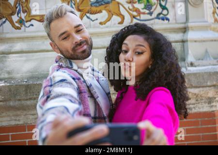 A young couple, taking selfies, making funny faces Stock Photo