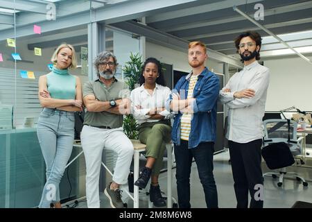 Portrait of confident multiracial professional business people team looking at camera serious face. Stock Photo