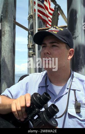 US Navy Torpedoman's Mate 2nd Class Kurt Stiener stands watch on board the US Navy's nuclear powered ballistic submarine USS RHODE ISLAND (SSBN 740), while on patrol in the western Atlantic. Base: USS Rhode Island (SSBN 740) Country: Atlantic Ocean (AOC) Stock Photo