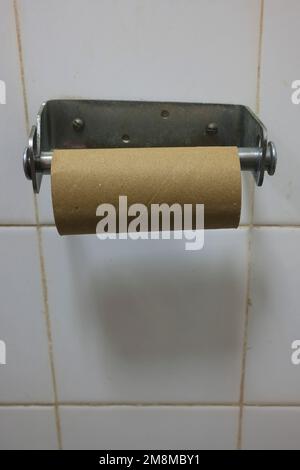 Empty toilet paper roll holder Stock Photo