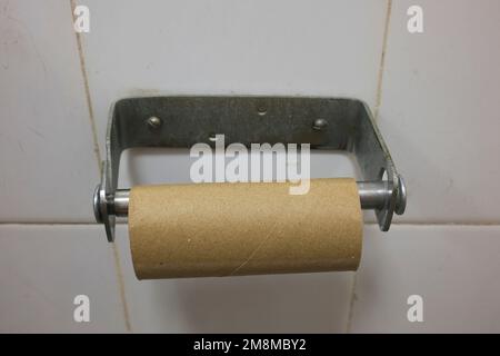 Empty toilet paper roll holder Stock Photo