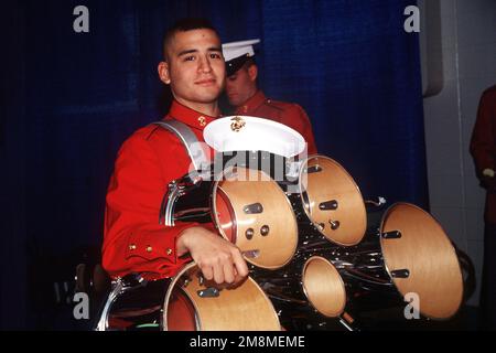 US Marine Corps Corporal (CPL) Anthony Perez a member of the Marine Corps Drum and Bugle Corps waits to perform at the US AIR Arena. State: District Of Columbia (DC) Country: United States Of America (USA) Stock Photo