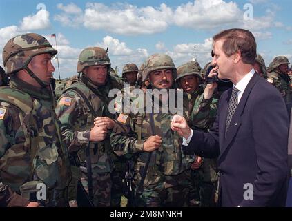 970711-D-9880W-195. [Complete] Scene Caption: Secretary of Defense William Cohen talks with soldiers from a platoon of the 3rd Battalion, 160th Infantry (Mechanized), a unit of the 40th Infantry Division (Mechanized), of the California Army National Guard, following the closing ceremonies of the NATO Partnership for Peace (PfP) training Exercise COOPERATIVE NEIGHBOR in Ukraine. The California National Guard is part of the Department of Defense's State Partnership Program, which matches US states with former East bloc countries. This provides the emerging democracies the opportunity to see how Stock Photo