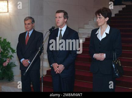 970713-D-9880W-148. [Complete] Scene Caption: Secretary of Defense William Cohen, flanked by Minister of Defense Georgi Ananiev (left) and Foreign Minister Nadezhda Mihailova (right), makes a statement to representatives of the news media in Sofia, Bulgaria. The July 13,1997, press availability was held at Boyana Residence, a government conference center, following a luncheon hosted for Cohen and his delegation by Bulgarian President Petar Stoyanov. Bulgaria has declared its desire for NATO membership, but was not realistically considered to be among the front runners for inclusion when the fi Stock Photo