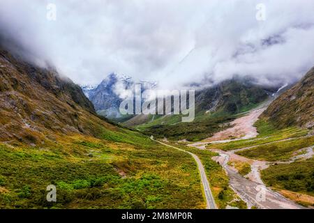 Monkey creek valley highway to Homer tunnel of Milford Sound fiord in New Zealand - scenic mountain landscape. Stock Photo