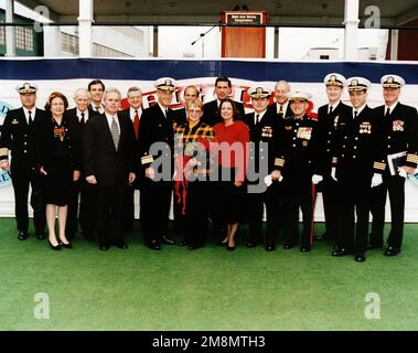 (Left to right) Captain Rubel; Mrs. Ruth Metcalf; Colonel Metcalf; the Honorable Tom Allen, Rep-Maine; Mr. Allan Cameron CEO-B/W; Mr. John Kuesters, Deputy PEO/AEGIS Program; Rear Admiral (Upper half) Michael T. Coyle, USN; the Honorable John Baldacci of Maine; Lieutenant Colonel Robin Higgins, USMC (Ret.) - ships sponsor; Senator Charles Robb of Virginia; Lieutenant Colonel Joanne Schilling, USMC (Ret.) matron of honor; Captain Ralph Staples, Honorable John Dalton, Secretary of the Navy; General Richard Neal, USMC; Commander James Smith; Commander John Ingram; Captain Larry Ellis, USN. Base: Stock Photo