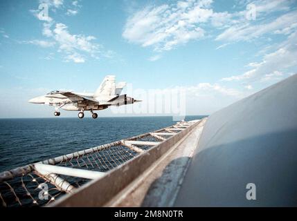 A United states Marine Corps, F/A-18C 'Hornet' from Marine Fighter Attack Squadron Two Five One (VMFA-251) clears the flight deck during sustained flight operations in the Persian Gulf. The nuclear powered aircraft carrier USS GEORGE WASHINGTON (CVN 73) and VMFA-251 are in the region to enforce U.N. sanctions against Iraq. Operation Southern Watch, 22 February 1998. Subject Operation/Series: SOUTHERN WATCH Base: USS George Washington (CVN 73) Stock Photo