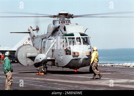 An HAS.2A AEW Sea King from British Royal Navy Helicopter Squadron 849, prepares to lift from the deck of the U.S. Navy aircraft USS GEORGE WASHINGTON (CVN 73). GEORGE WASHINGTON is deployed to the Persian Gulf in support of Operation Southern Watch. Subject Operation/Series: SOUTHERN WATCH Base: USS George Washington (CVN 73) Country: At Sea Stock Photo