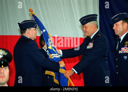 US Air Force General John P. Jumper, Commander US Air Forces in Europe, passes the Command Colors to USAF Lieutenant General (LGEN) Richard C. Bethurem as Lieutenant General Michael C. Short stands by during the 16th Air Force Change of Command Ceremony. LGEN Bethurem will relinquish his command to LGEN Short who is the former MAJCOM Deputy of Operations. Base: Torrejon Air Base Country: Spain (ESP) Stock Photo