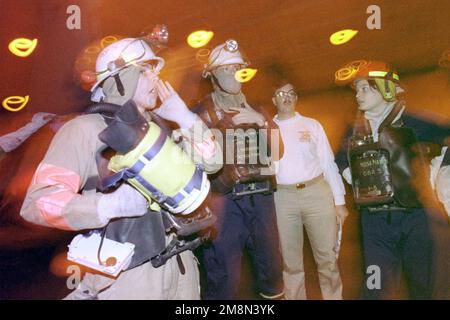 US Navy sailors conduct training with fire fighting equipment aboard the nuclear powered aircraft carrier USS JOHN C. STENNIS (CVN 74) while stationed in the Persian Gulf. The JOHN C. STENNIS is currently deployed in the Persian Gulf is support of Operation SOUTHERN WATCH, 6 May 1998. Subject Operation/Series: SOUTHERN WATCH Base: USS John C. Stennis (CVN 74) Stock Photo