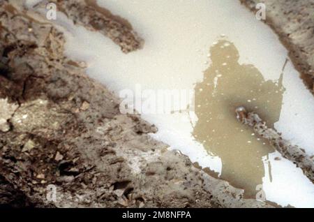 The reflection of a Republic of Korea Army (ROKA) soldier at the Twin Bridges training area on Oct. 31, 1998. Twin Bridges, located 25 minutes west of Tongduch'on, Republic of Korea, is the site for a simulated battle on Nov. 2 1998 between a ROKA armored brigade and the 3rd Brigade, 2d Infantry Division from Fort Lewis, Washington, during the combined exercise Foal Eagle '98. Subject Operation/Series: FOAL EAGLE '98KOREA CD Base: Tongduchon Country: Republic Of Korea (KOR) Stock Photo