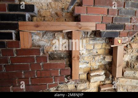 Rostock, Germany. 03rd Jan, 2023. On the facade of the water tower, parts of the facing masonry are being supported that have detached from the load-bearing masonry behind it. Renovation of the water tower, which was built in 1903, had begun in May 2018 and is scheduled to be completed in 2024 according to current plans. The tower, which is more than 40 meters high, has long had problems with moisture penetrating the masonry. Credit: Bernd Wüstneck/dpa/Alamy Live News Stock Photo