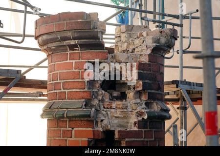 Rostock, Germany. 03rd Jan, 2023. On the roof of the water tower under a building tarpaulin, only remains of one of the original seven copper-covered turrets can be seen. Six of them were dismantled for the refurbishment. The renovation of the water tower, built in 1903, had begun in May 2018 and is scheduled to be completed in 2024, according to current plans. The tower, which is more than 40 meters high, has long had problems with moisture seeping into the masonry. Credit: Bernd Wüstneck/dpa/Alamy Live News Stock Photo