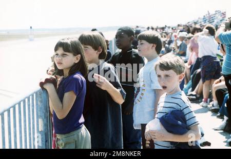 On the Tyndall AFB flightline during the annual air show, special needs children react to the aerial performance by the Air Force Thunderbirds. Base: Tyndall Air Force Base State: Florida (FL) Country: United States Of America (USA) Stock Photo