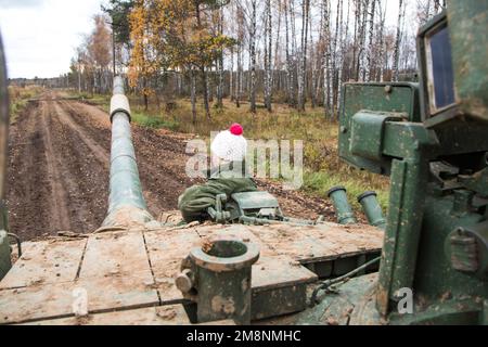 Russian tank rides on a forest road Stock Photo