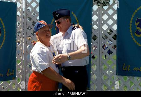 US Air Force Colonel Paul Curtis (Right) congratulates a first place winner during the '99 Northern Santa Barbara County Special Olympic Games held on April 17th, 1999 at Vandenberg Air Force Base, California. This image is seen in the April 1999 edition of AIRMAN Magazine. Base: Vandenberg Air Force Base State: California (CA) Country: United States Of America (USA) Stock Photo