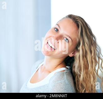 Young and free. A striking young blonde feeling free and relaxed. Stock Photo