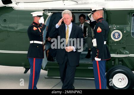 President William Jefferson Clinton salutes as he exits Marine One, a UH-60 Black Hawk Helicopter. This event took place at Peterson Air Force Base, Colorado, on June 2nd, 1999. Base: Peterson Air Force Base State: Colorado (CO) Country: United States Of America (USA) Stock Photo