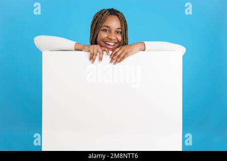 African woman holding a banner with an empty space Stock Photo