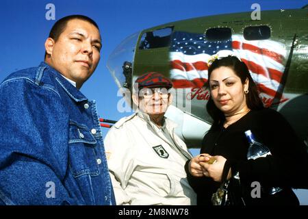 Luis Franco (center) talked Paul Hernandez (left) into quitting a tough Los Angeles gang. 'He kept me from killing or getting killed,' Hernandez said. Lanette Lombardo (right) Franco's grand daughter, is Hernandez's girlfriend. This photograph is part of the article 'Beating the Demons,' AIRMAN Magazine, September 1999 issue. Base: March Air Reserve Base State: California (CA) Country: United States Of America (USA) Stock Photo