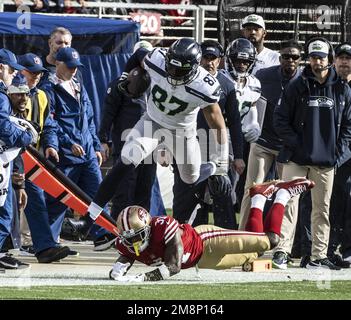 Seattle Seahawks tight end Noah Fant (87) catches a pass and runs