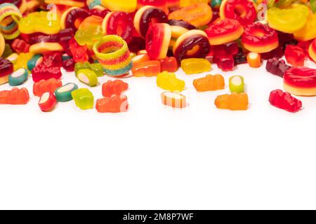 Assorted colorful gummy candies. Top view. Jelly donuts. Jelly bears. Isolated on a white background. Stock Photo