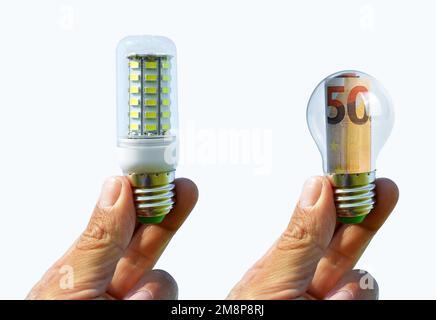Hands holding light bulb isolated on white background. Concept of saving money for energy. Stock Photo
